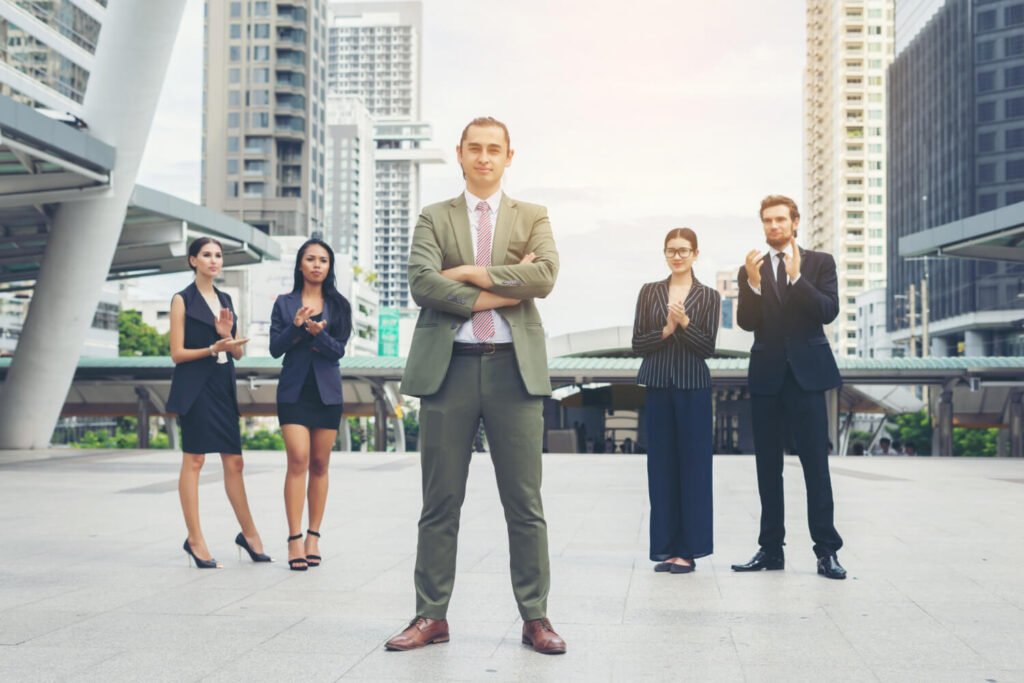 Team of business professionals standing together outdoors